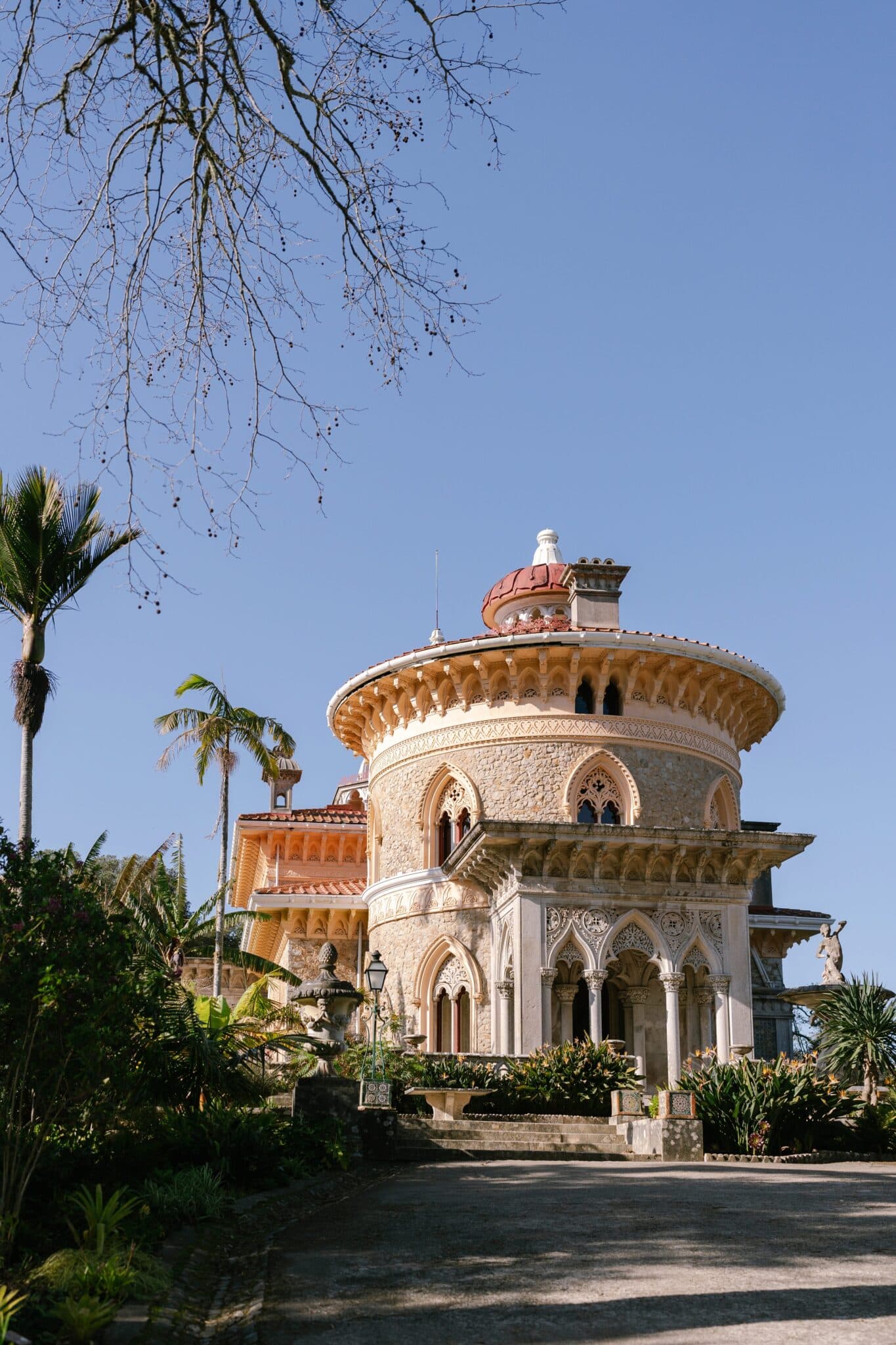 The round tower and red dome of Monserrate Palace seen from the garden path, Sintra The round tower and red dome of Monserrate Palace seen from the garden path, Sintra