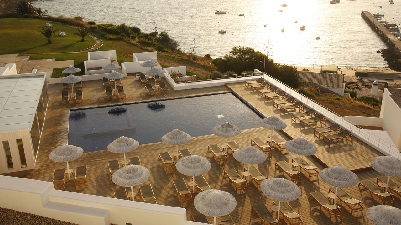 Terrace and pool above the bay of Sagres in the evening sun, Memmo Baleeira Terrace and pool above the bay of Sagres in the evening sun, Memmo Baleeira
