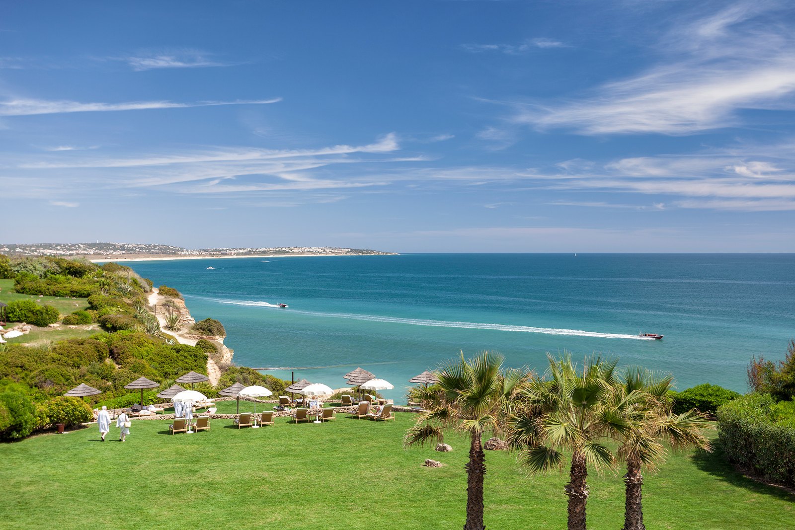 Gardens and palms on the cliff top above a turquoise sea, Vila Vita Parc, Porches Gardens and palms on the cliff top above a turquoise sea, Vila Vita Parc, Porches
