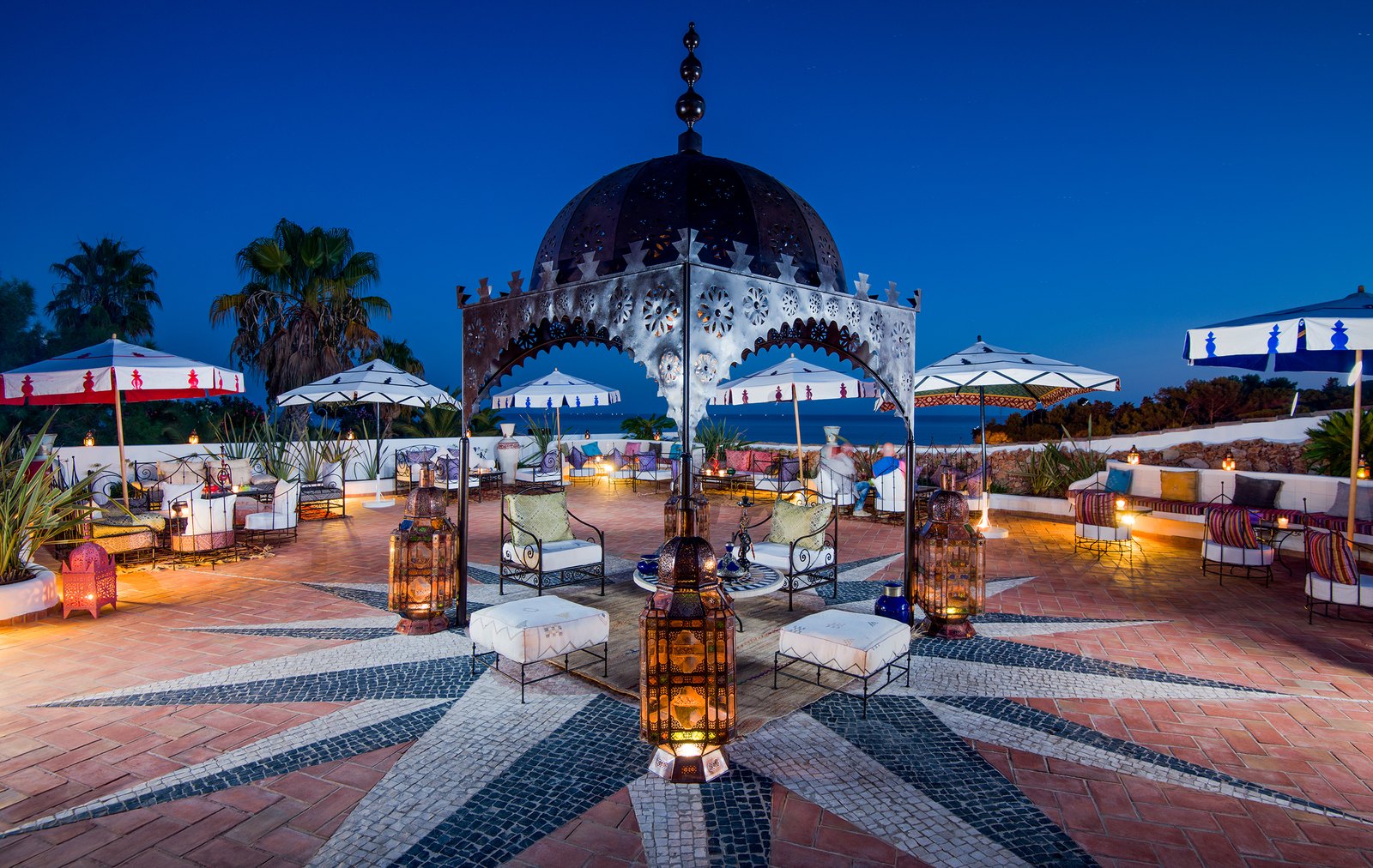 The Moorish Manzar terrace with lanterns glowing at dusk, Vila Vita Parc, Porches The Moorish Manzar terrace with lanterns glowing at dusk, Vila Vita Parc, Porches