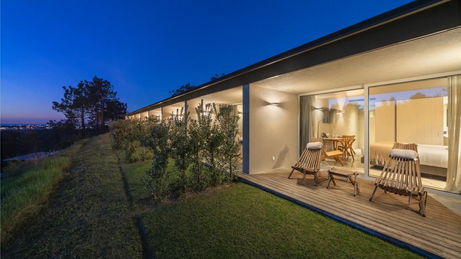 Glass-fronted suite with a deck in the valley at dusk, Immerso, Ericeira Glass-fronted suite with a deck in the valley at dusk, Immerso, Ericeira