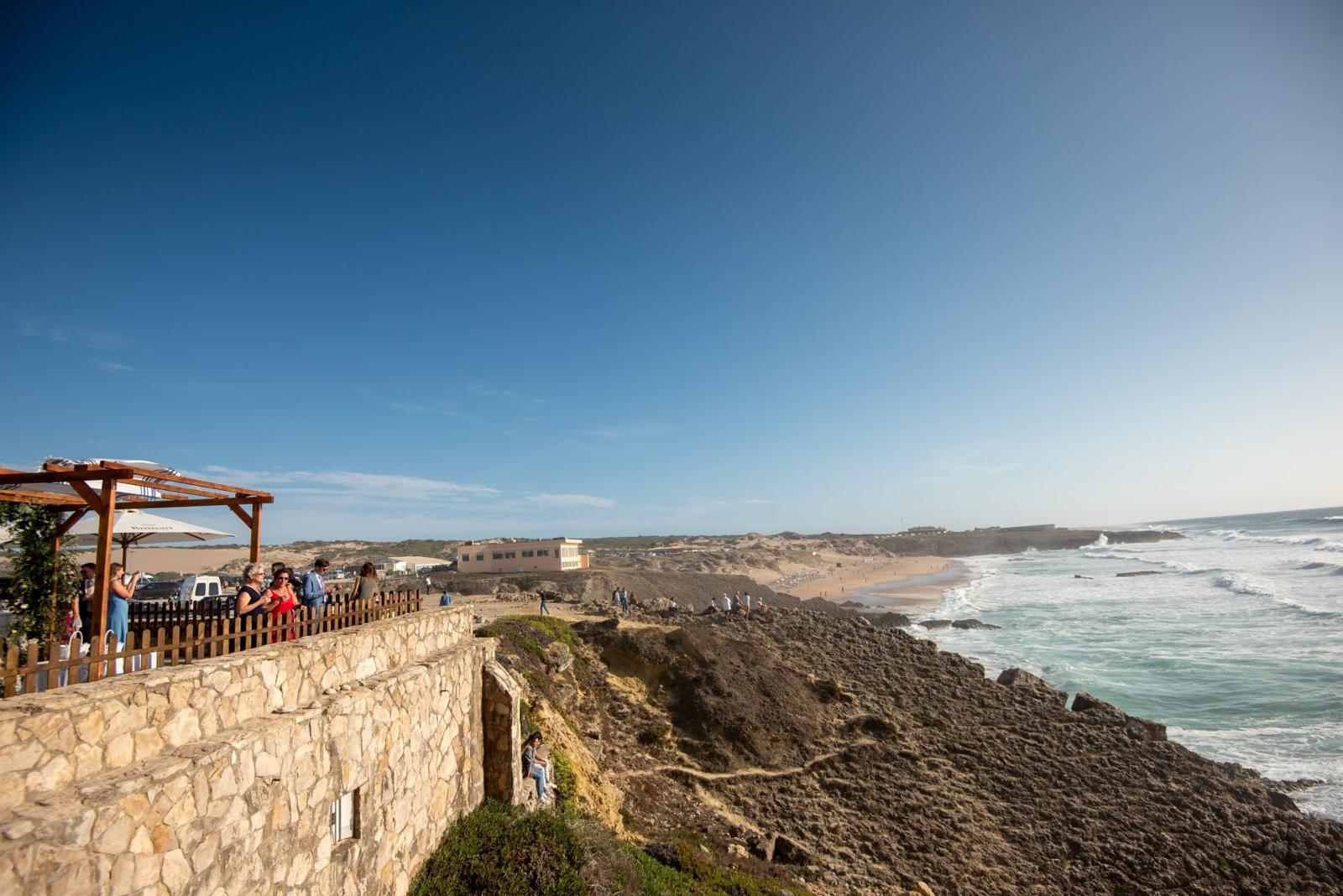 Cliff-top terrace with a timber pergola above Guincho beach and the Atlantic surf, Fortaleza do Guincho, Cascais