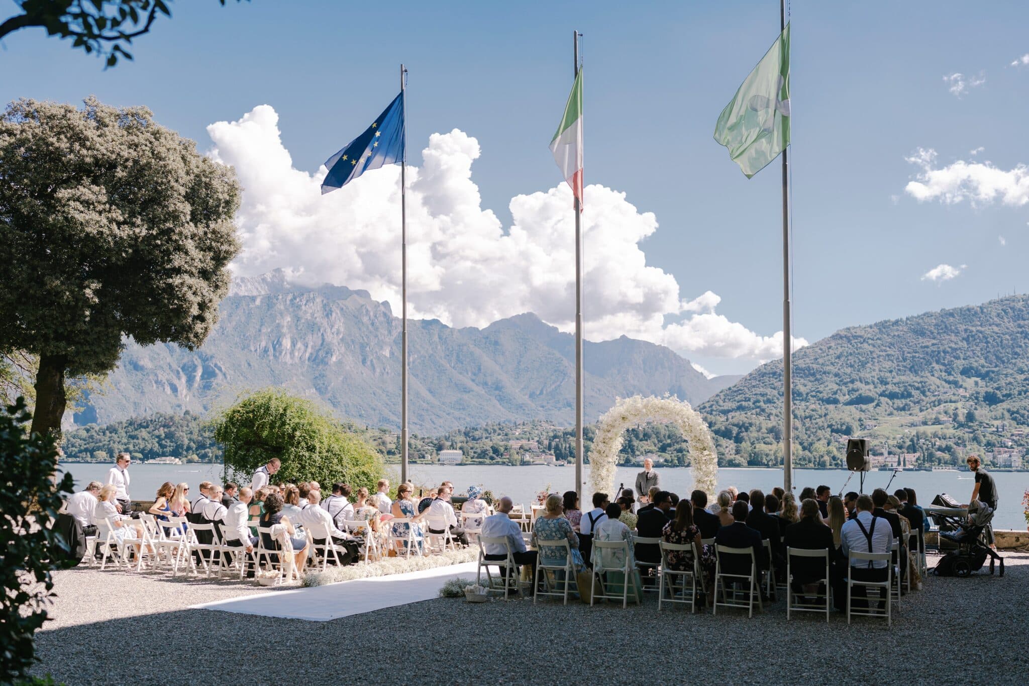 Outdoor wedding ceremony at Villa Carlotta overlooking Lake Como and mountains