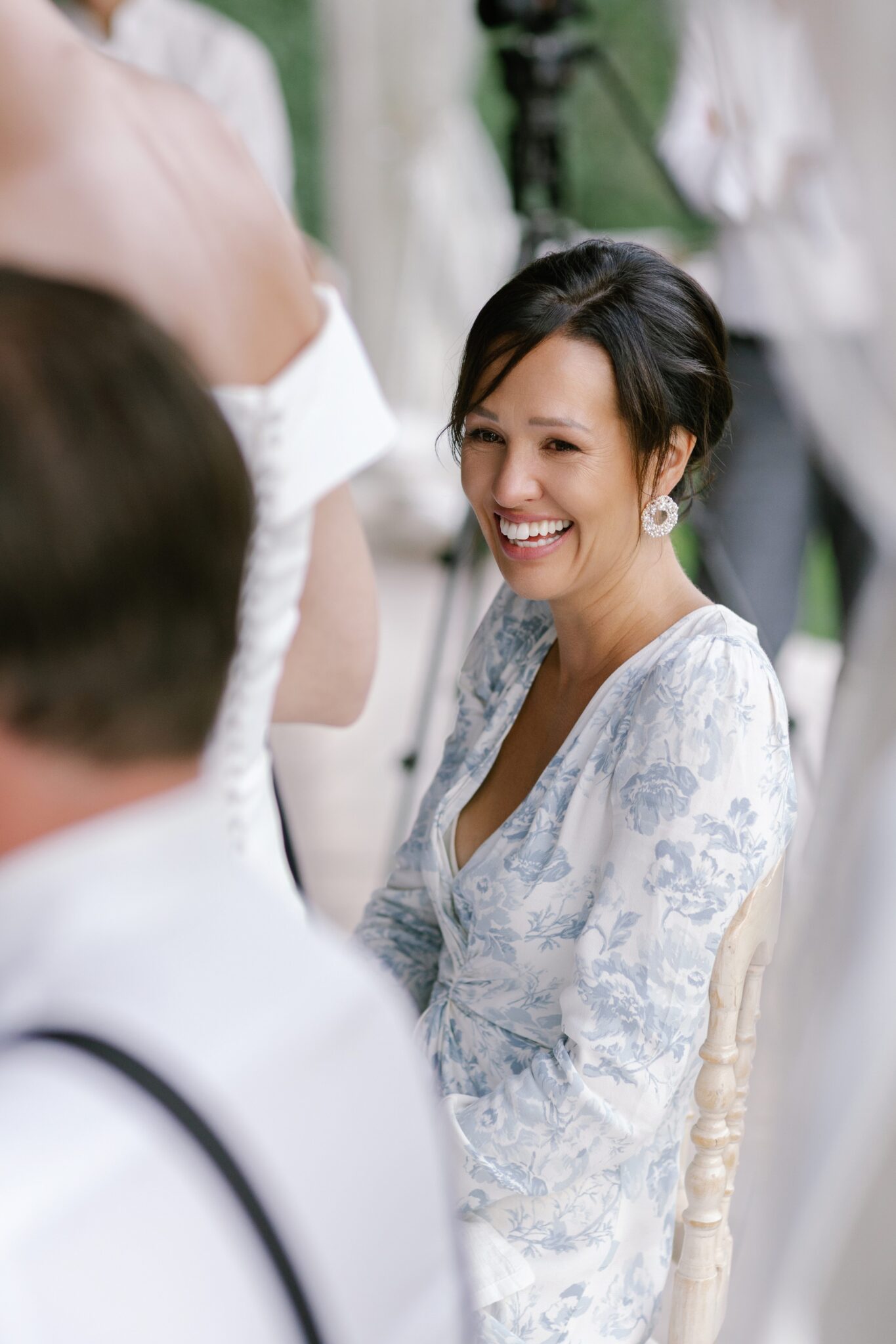 Female wedding guest smiling warmly during the Villa Carlotta reception.