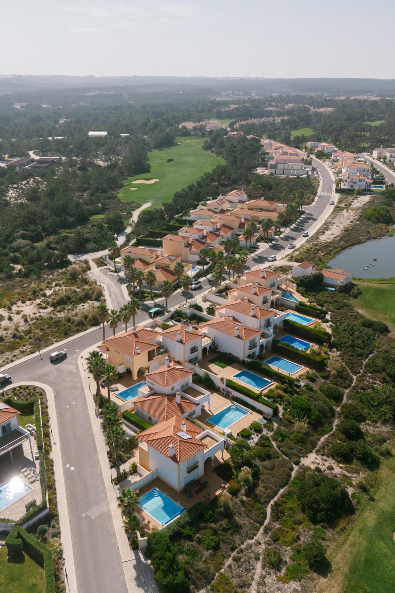 Aerial view of Praia del Rey coastal village and golf course in Portugal